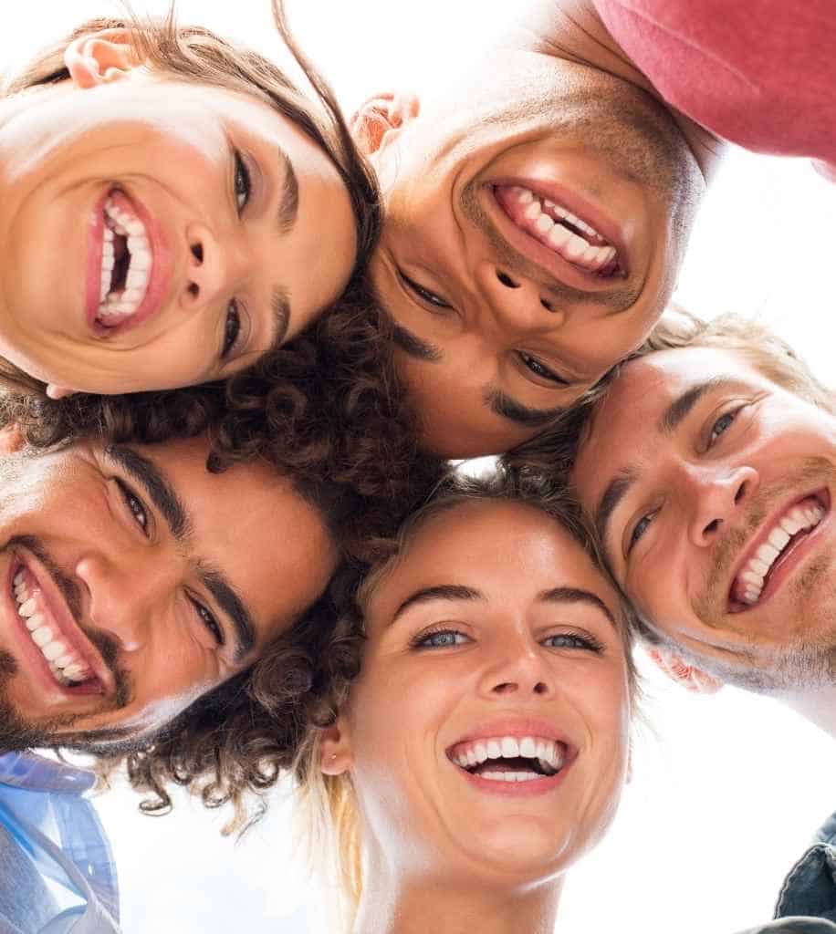 Smiling person showcasing white teeth after laser whitening treatment Market Harborough